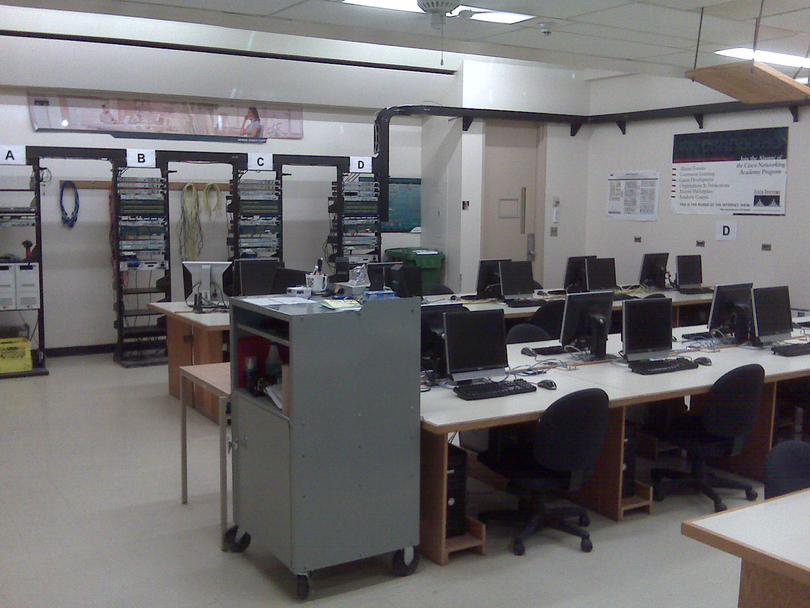 Cisco classroom workstations and network racks. The patch panels on the racks terminated on the desks.